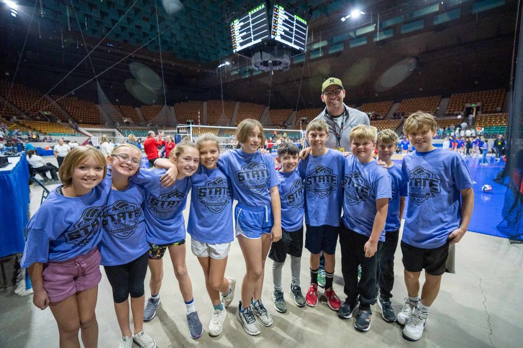 Longmont Estates students and P.E. teacher Mike Newell gather for a group photo before the tournament starts.